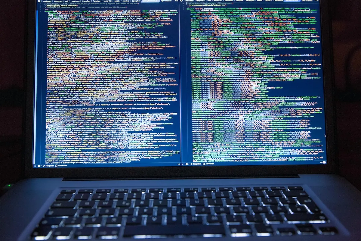 Computer screen showing multiple complicated lines of code