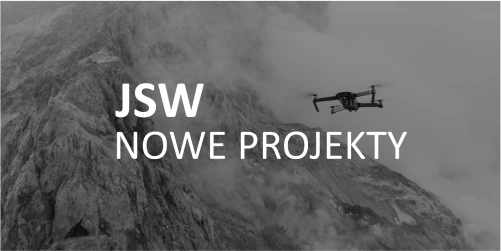 JSW Nowe Projekty letter logo overlayed over drone filying over mountain background